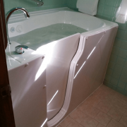 Walk in tub fully filled with jets