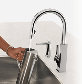 Hands free faucet in use
