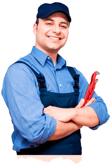 Smiling plumber holding red pipe wrench with arms crossed.