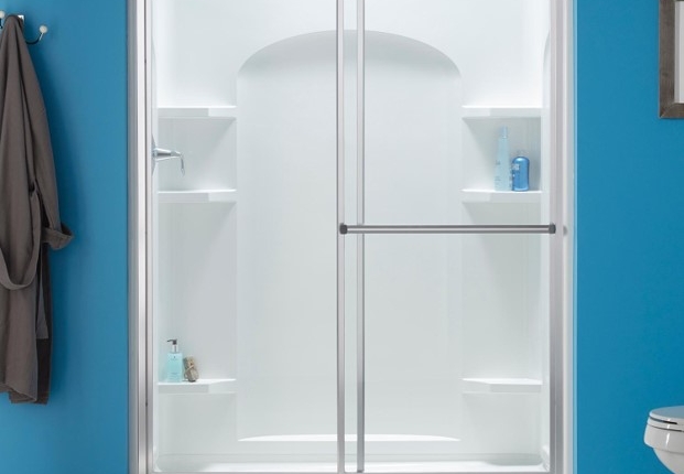 Modern glass shower enclosure with frosted panels in a bright bathroom.
