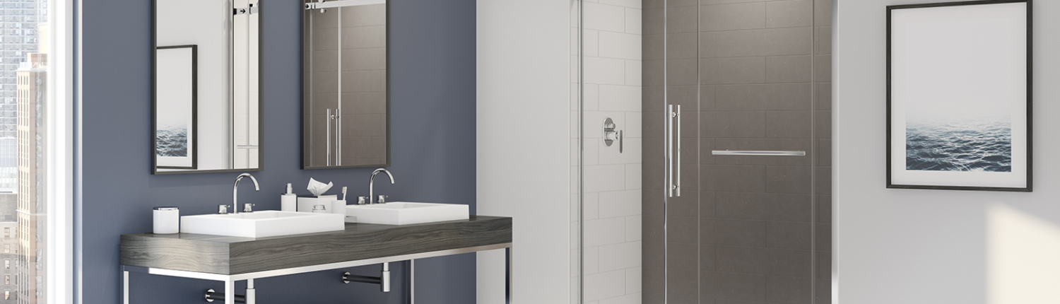 Modern bathroom with double sinks and a glass shower enclosure.