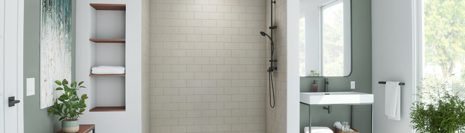 Modern bathroom with glass shower and wooden vanity.