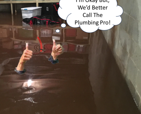 A man standing ankle-deep in water in a flooded basement, looking concerned as he assesses the damage. Boxes and furniture are partially submerged, highlighting the severity of the flooding.